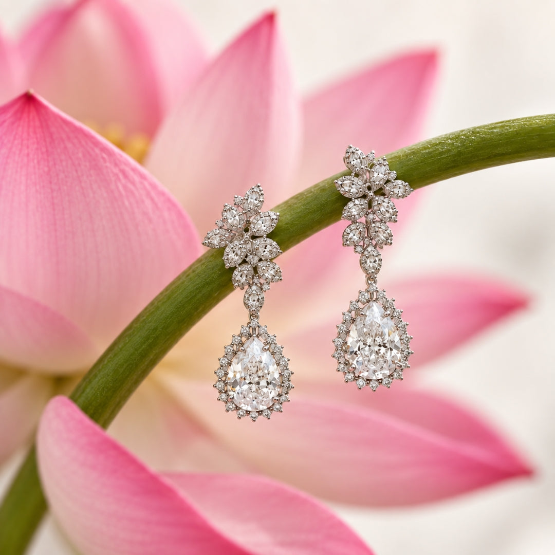 Miayaa Lotus Bloom Pear Drop Earrings - lifestyle shot with lotus flower