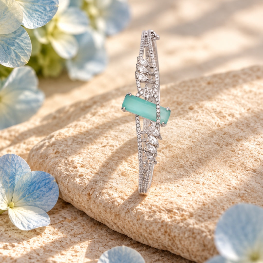 Miayaa Aqua Bloom Marquise Bangle - lifestyle on stone with hydrangeas