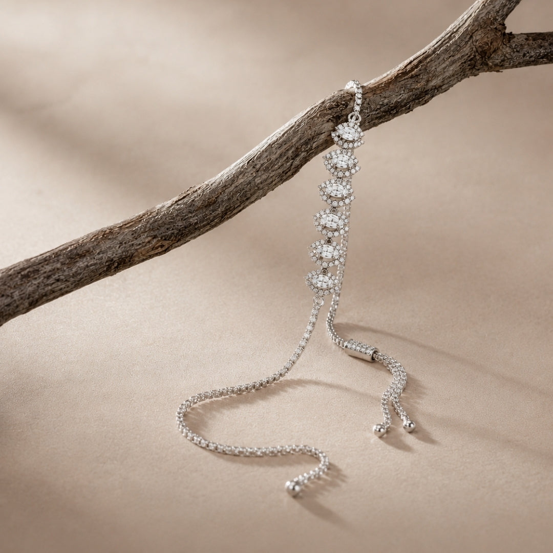 Crystal station bracelet with an adjustable chain styled on natural wood